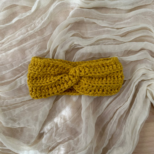 Diadema para bebé con diseño de espiral, de color amarillo brillante